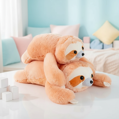 Two Plush sloth toys on a bed with a light blue wall in the background