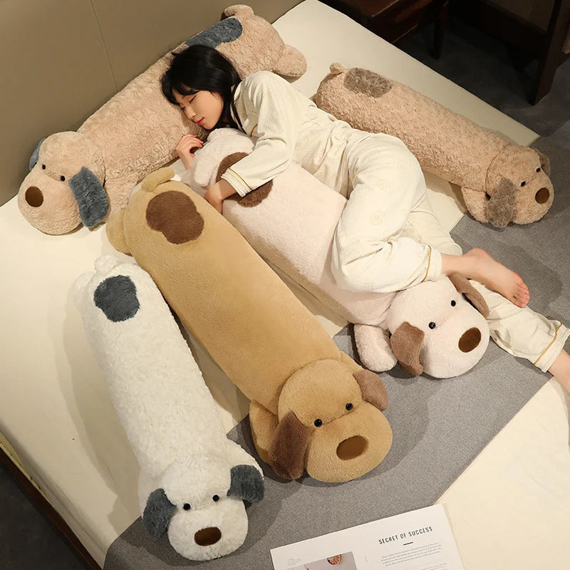 Person lying on a bed with large dog-shaped plushie body pillows