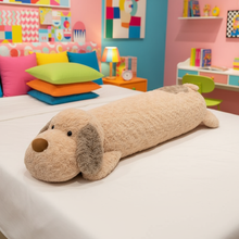 Light brown dog plushie body pillow laying on a bed in a vibrant bedroom setting