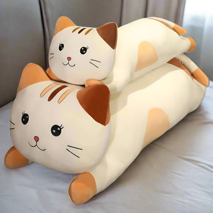 Cat-shaped plushie pillow on a surface with a blurred background