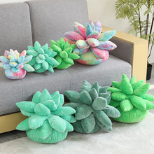 Colorful succulent-shaped plush cushions on a gray sofa and floor.