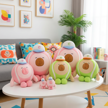 Several capybara plush tennis ball toys sitting on a table in a colorful room