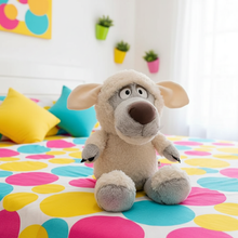 Plush wolf toy on a colorful polka dot blanket with a white wall and plants in the background