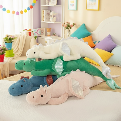 Colorful plush toy dragons on a bed in a child's room with colorful pillows and decorations.