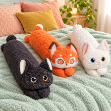 Black, Orange, and White Bright Eyes long cat plush body pillows together on a mint bed.