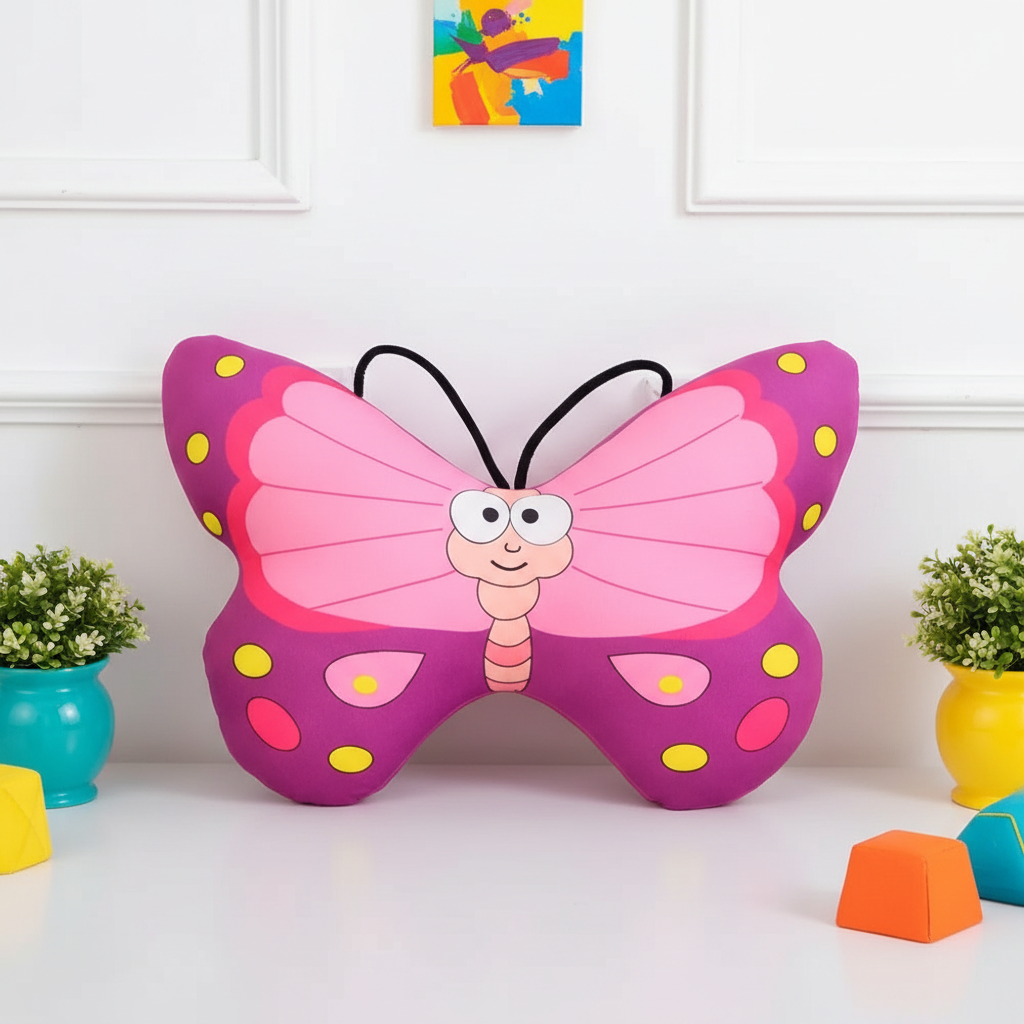 Colorful butterfly-shaped cushion on a white surface with decorative elements.