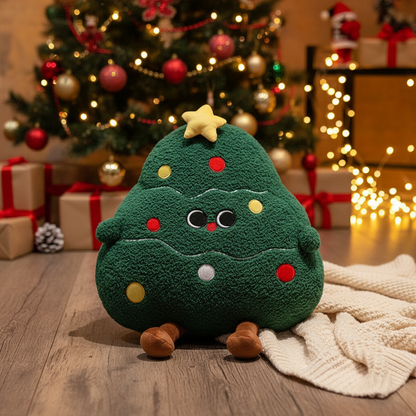 Plush toy shaped like a Christmas tree in front of a decorated tree with lights and presents.