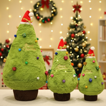 Three green plush Christmas trees with Santa hats and colorful ornaments on a festive background.
