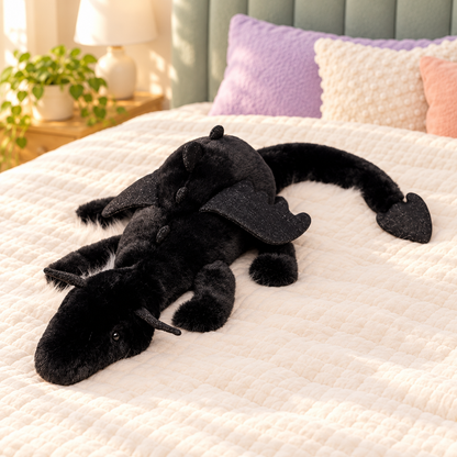 Black Dreamwing dragon plushie with matching black wings, small horns and a curled tail.