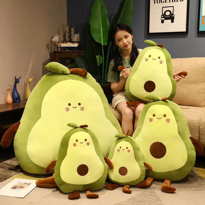 avocado plushies in a group of different sizes