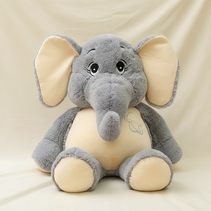 Plush elephant toy with gray body and beige ears and feet on a beige background