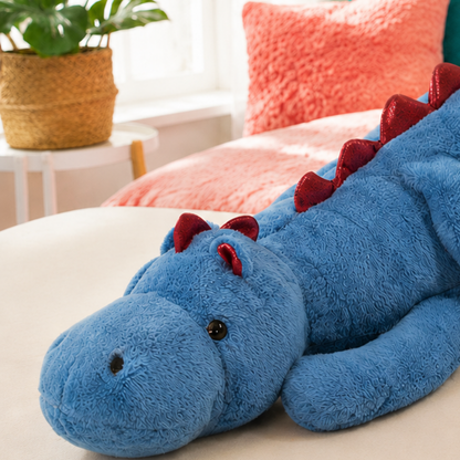 Close-up of the blue Mythic Hugs dragon’s short snout, soft fur, bead eye and red satin details.