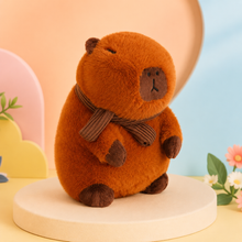 Scarf Wearing Capybara Plushie with brown knitted scarf