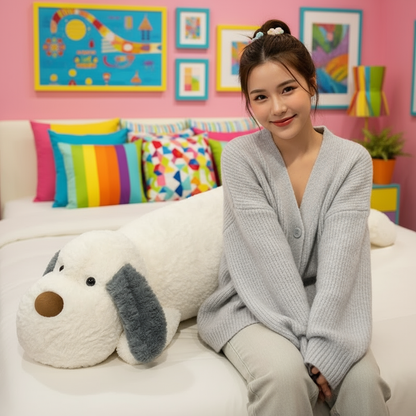 Woman sitting on a bed with a large dog-shaped pillow in a colorful room.