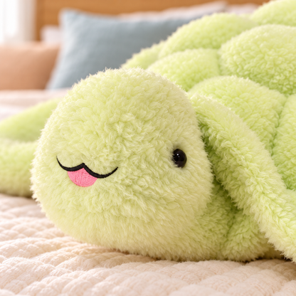 Close-up of the Snuggle Shell turtle’s small black eyes, stitched smile and little pink tongue.