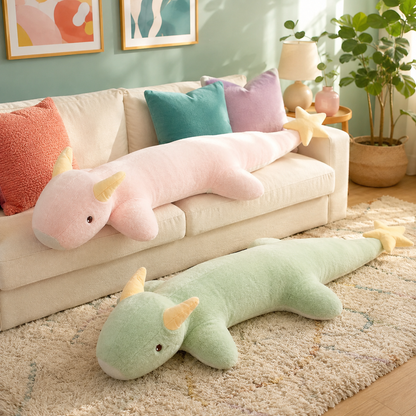 Blush pink and mint green Starry Snooze long dragon plushie body pillows displayed in a colorful living room