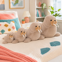 Four warm taupe Wally Wobbles walrus plushies arranged from smallest to largest on a colorful bed.